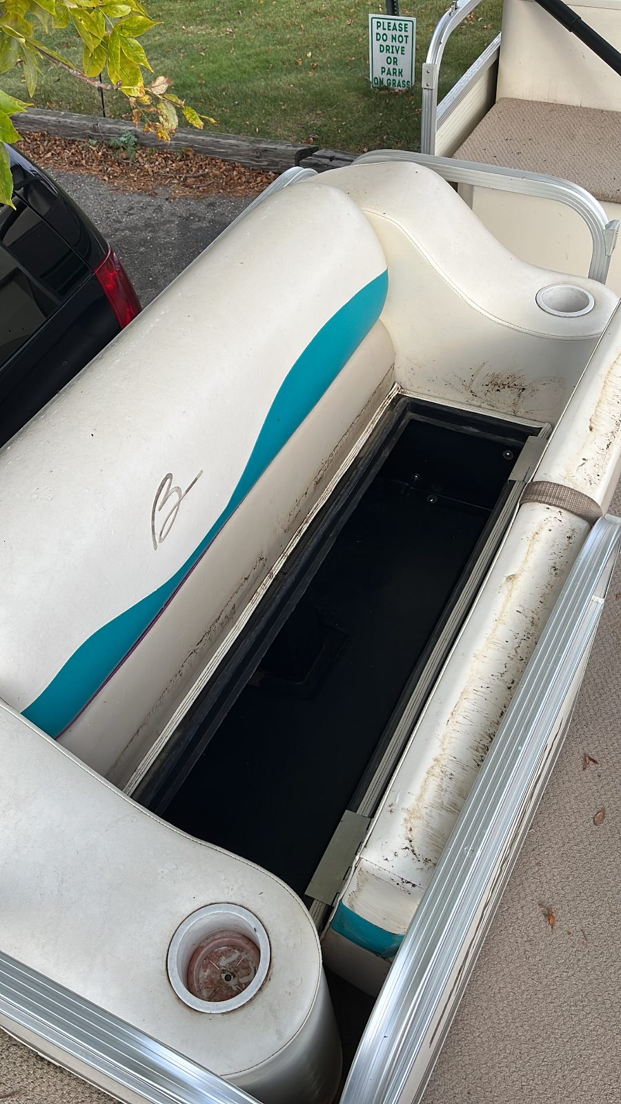 Bennington pontoon seats before detailing — faded and stained vinyl