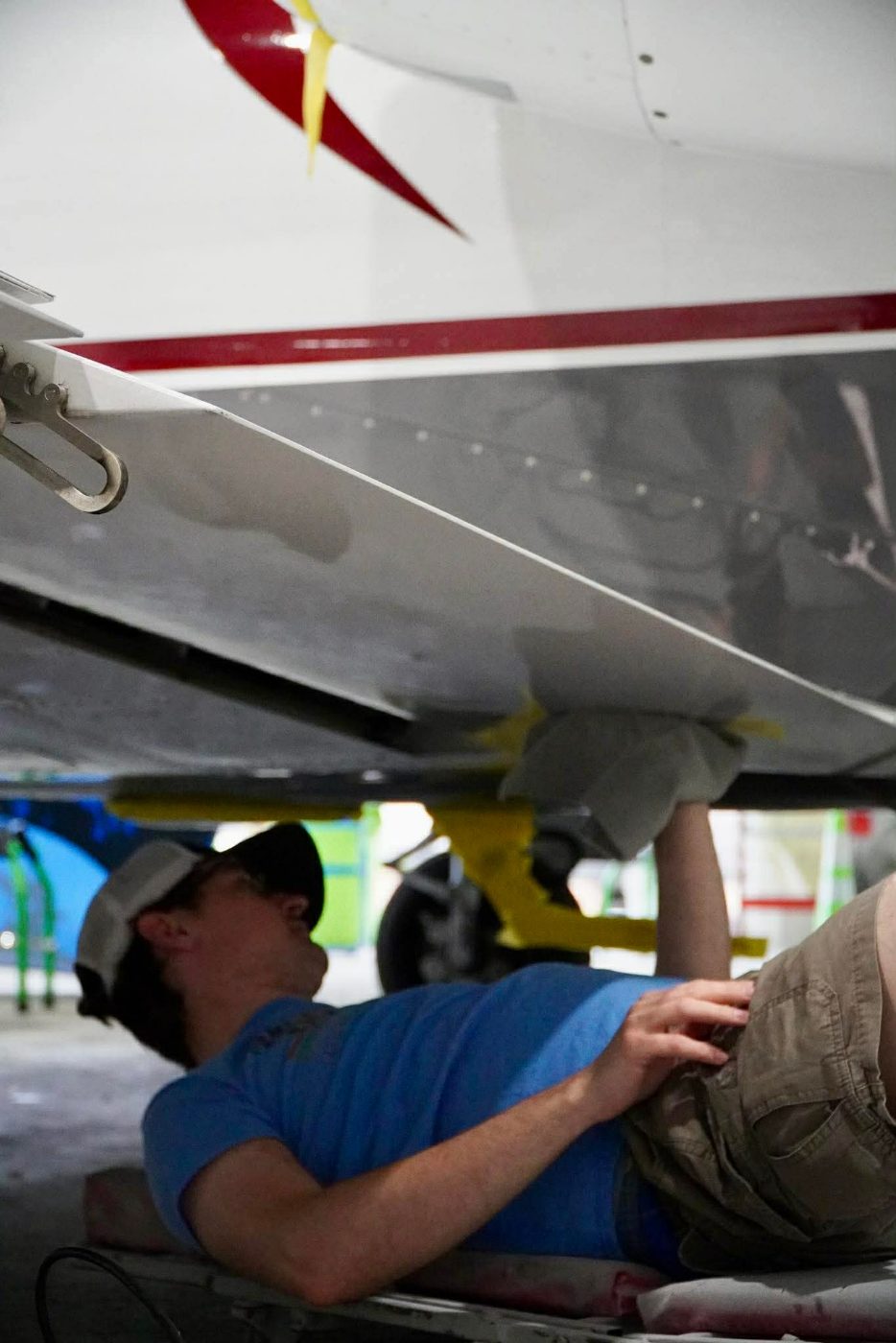 Zachary detailing a business jet, hands-on in the hangar